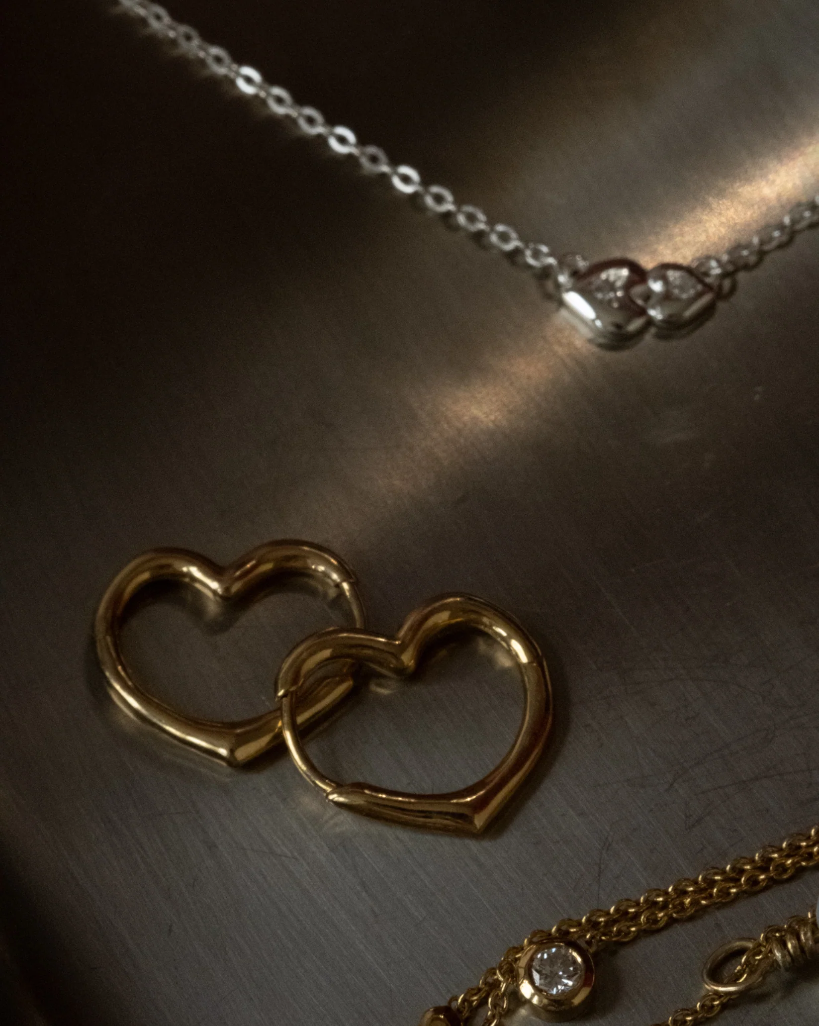 Croia Solid Gold Heart Huggie Hoops - Image 10