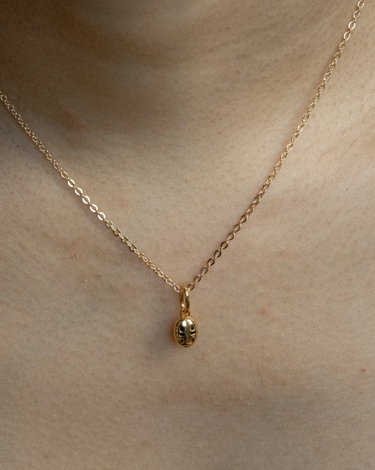 Solid Gold No Face Charm - Image 2